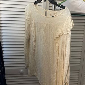 Cream colored thin material, shirt.